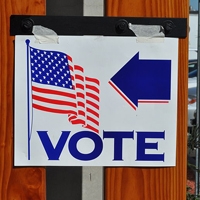 A poster advertising a polling place (Photo by Tom Arthur | Wikipedia)  