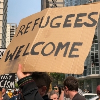 Protest on behalf of refugees.Image courtesy of Master Steve Rapport via Flickr