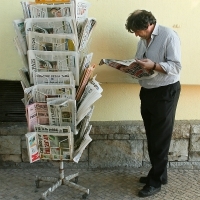 Reading the News in Estoril. Photo by David Dennis