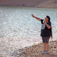 Shasta Reservoir, CA — Chief Caleen Sisk on the shoreline near where she says a Winnemem Wintu village site was flooded out by Shasta Dam. October 30, 2018. Tom Levy/The Spiritual Edge