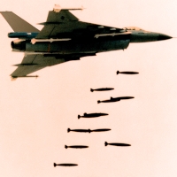 F16-delivering a payload of unguided bombs. This work was produced by the United States government, and is in the Publice domain. Colors in the image have been altered for artistic effect. 
