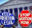 Pro and anti-abortion activist desplay protest signs in front of the United States Supreme Court. 